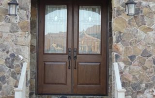 a pair of double doors on a stone building