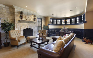 a living room filled with furniture and a fire place