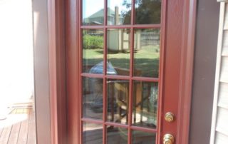 a red front door with glass panes