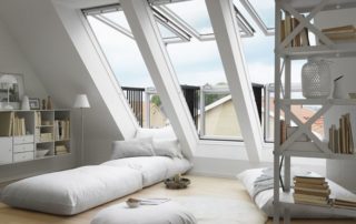 a living room filled with lots of white furniture