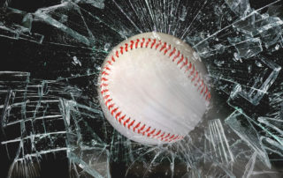 baseball smashing a glass window