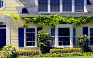 single pane windows on a yellow house