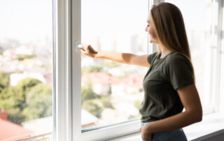 Woman With A Smile Opens High-Quality Replacement Window