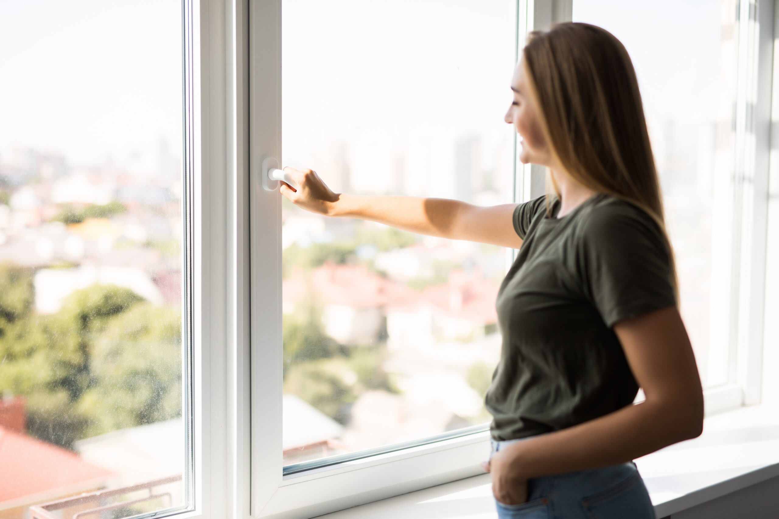 Woman With A Smile Opens High-Quality Replacement Window